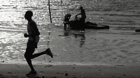 Man running at the beach Brazil  Stock Footage 62318497