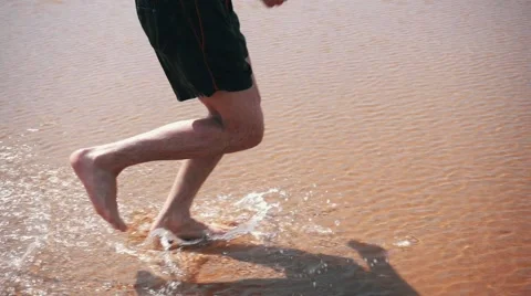 Man Running on Beach closeup Stock Footage 55450090
