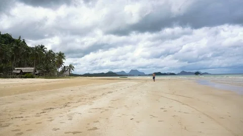 Man running on the beach Stock Footage