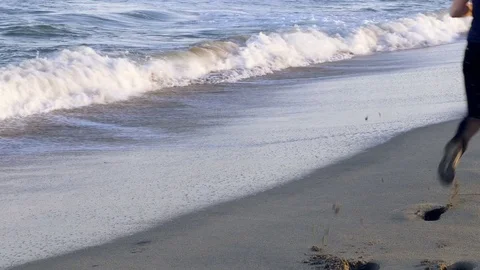 Man running on the beach Stock Footage 73927895