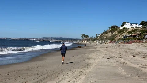 Man Running on the Beach Stock Footage 102613810
