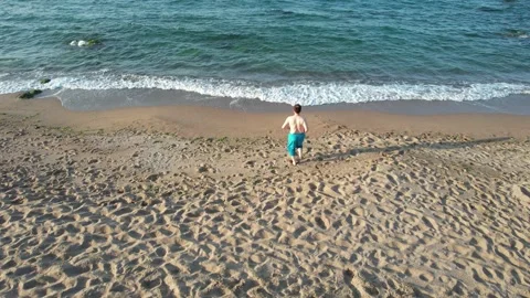 Man running beach Stock Footage 206760485