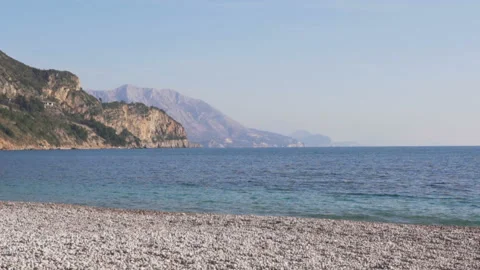 Man is running on the Beach near the sea with a little Airplane toy Stock Footage 104836341