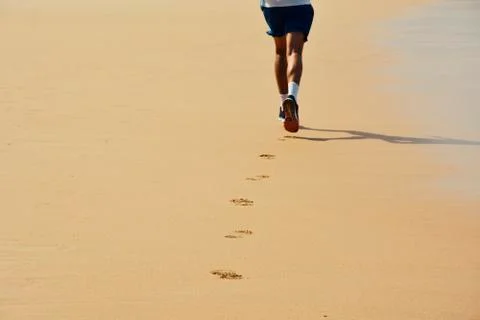 Man Running on the Beach Stock Photos