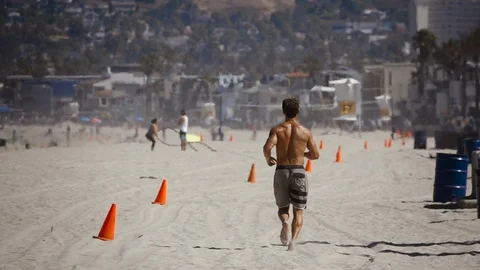 Man Running On Beach Slow Motion Stock Footage 116990648