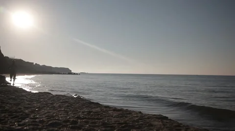 Man running on beach at sunrise. Stock Footage 66798074