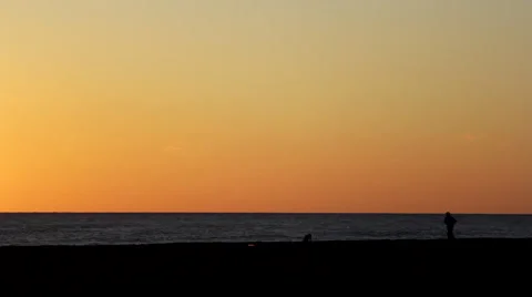 Man Running on the Beach at Sunset, Man Practicing on the Beach at Sunset Stock Footage 63573861