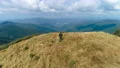 The man running on the beautiful mountain hill 4k or 4k+ Resolution