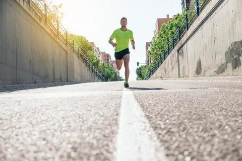 Man running in the city. Stock Photos