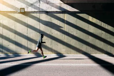 Man running in the city. Stock Photos