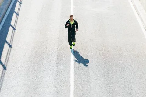 Man running in the city. Stock Photos