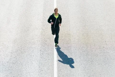 Man running in the city. Stock Photos