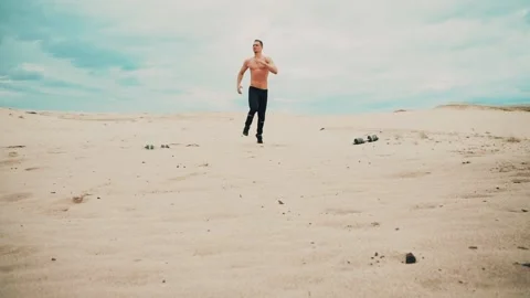 Man is running in desert Stock Footage 90487034