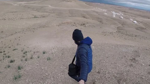 Man running down a desert Stock Footage 127840870