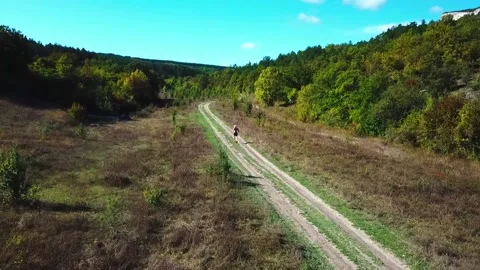 A man is running down the road Stock Footage 169872235