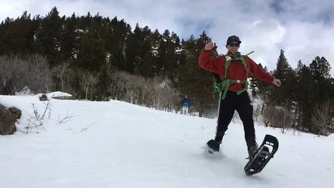 Man Running Down Snowy Hill In Slowmotion in Colorado Stock-Footage 102082872