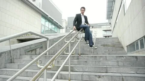 Man running down stairs in town Video stock 14830123