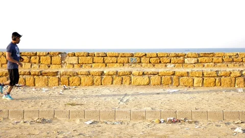 Man running in an empty road Stock Footage 93457955