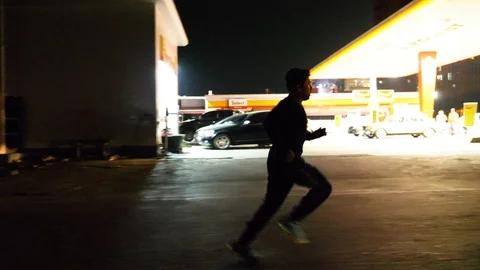 Man running in an empty road Stock Footage 93458560