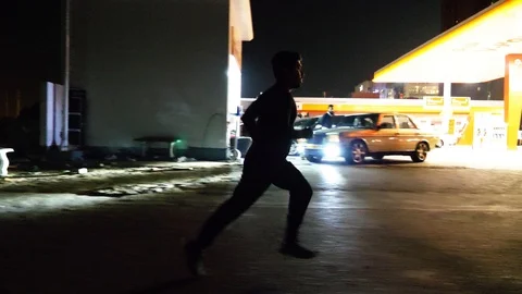 Man running in an empty road Stock Footage 93458622