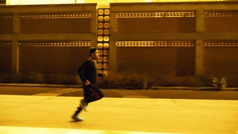 Man running in an empty road Stock Footage 93458857