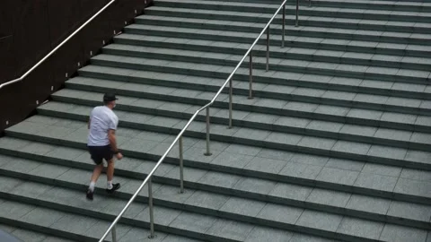 Man Running Up An Empty Urban Concrete Staircase Stock Footage 145239935