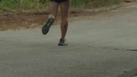 Man running filmed from back only legs, HD 動画素材 130672314