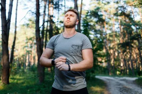 Man running at forest Stock Photos