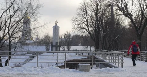 Man is Running Foreward And Skating Three Times Snow Frosty Winter Man in Red Stock Footage 58820853