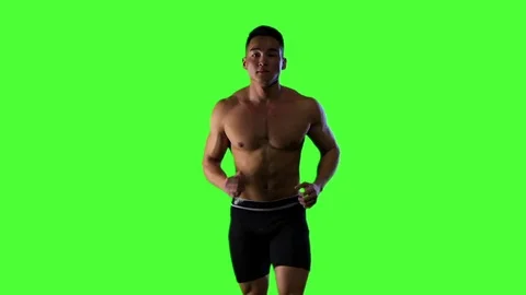 Man running on green screen background, slow motion, drop shadow Stock Footage 74083219
