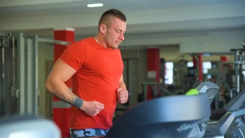 Man running in a gym on treadmill Video stock 88615500