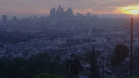 Man Running Up Hill At Sunset Skyline Los Angeles 3 Stock Footage 78993079