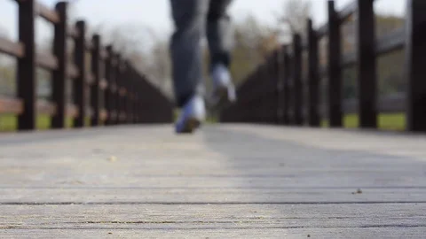 Man running with his back to the camera Stock Footage 123053564