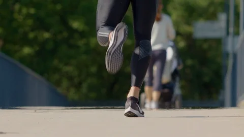 Man running / jogging / runner / bridge / legs Stock Footage 110799805
