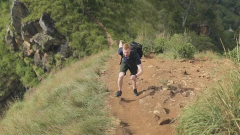 Man running in mountain with backpack Vídeo Stock 109421372