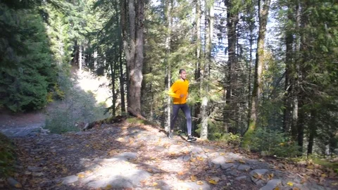 Man running in mountain forest. Trail running Stock Footage 82702774