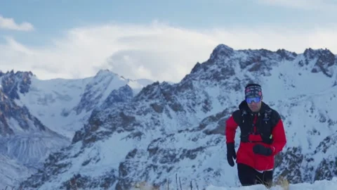 Man running at the mountain with snow Video stock 167199232
