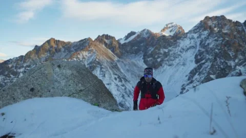 Man running at the mountain with snow Stock Footage 167213910