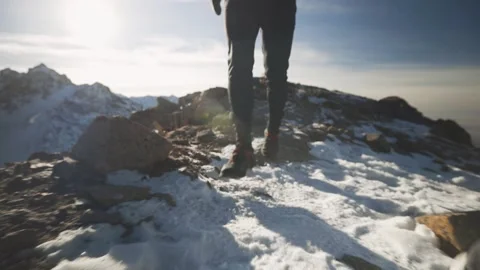 Man running at the mountain with snow Video stock 167600994