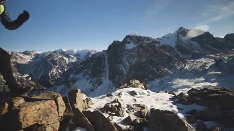 Man running at the mountain with snow Stock Footage 167676274