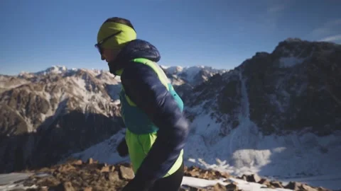Man running at the mountain with snow Stock-Footage 168349406