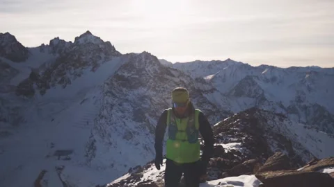 Man running at the mountain with snow Video stock 168349549