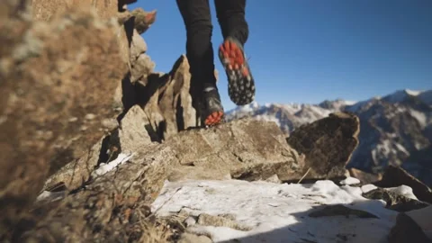 Man running at the mountain with snow Stock Footage 168349958