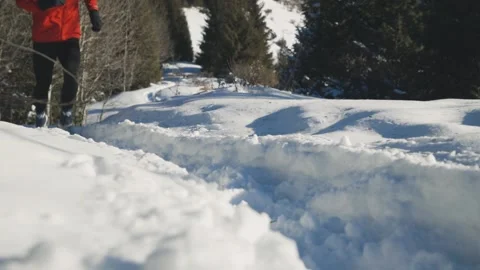Man running at the mountain with snow Stock Footage 169927385