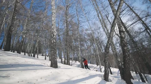 Man running at the mountain with snow Stock Footage 169928454