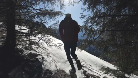 Man running at the mountain with snow Stock Footage 170059090