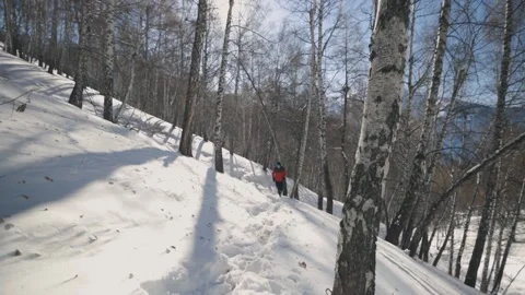 Man running at the mountain with snow Stock Footage 170428613