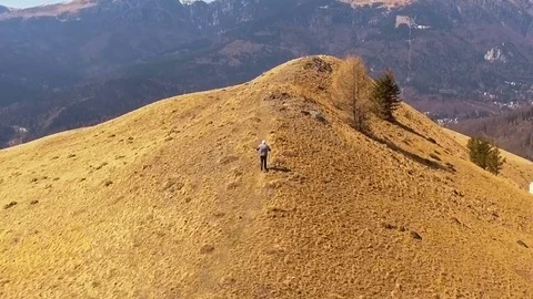 Man running to mountain top Stock-Footage 74257571