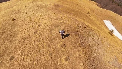 Man running to mountain top Stock-Footage 74257923