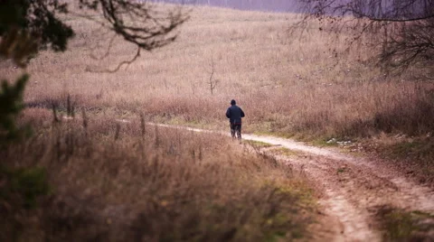 Man running near forest through rural road Stock Footage 60062182